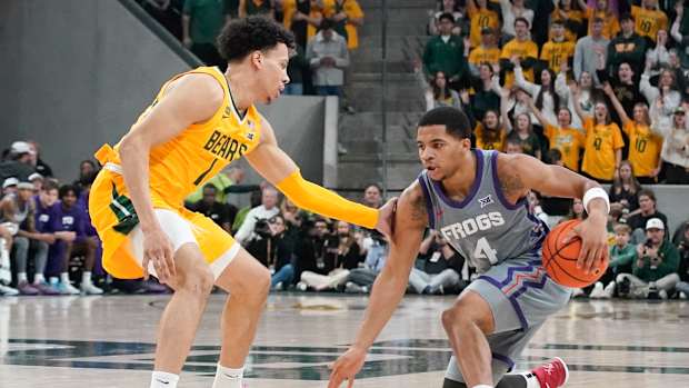 Jan 27, 2024; Waco, Texas, USA; TCU Horned Frogs guard Jameer Nelson Jr. (4) works on Baylor Bears guard Miro Little (1) during the first half at Paul and Alejandra Foster Pavilion. Mandatory Credit: Raymond Carlin III-USA TODAY Sports  